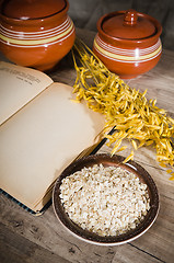 Image showing  Still life with oatmeal and an open book