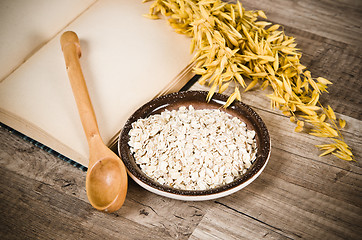 Image showing  Still life with oatmeal and an open book