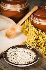 Image showing  Still life with oatmeal and an open book