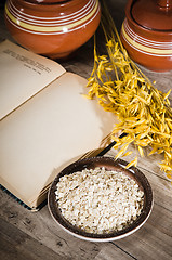 Image showing  Still life with oatmeal and an open book