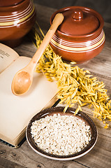 Image showing  Still life with oatmeal and an open book