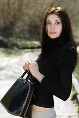 Image showing Brunette in black blouse