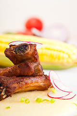 Image showing pork ribbs on polenta corn cream bed