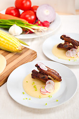 Image showing pork ribbs on polenta corn cream bed