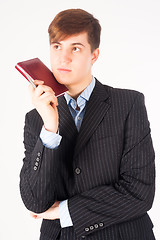 Image showing businessman holding diary log