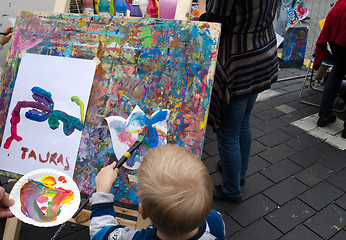 Image showing kid draw paintings brush outdoor street event 