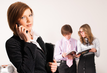 Image showing Businesswoman calling by phone in office