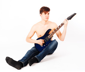 Image showing young fit male with electric guitar