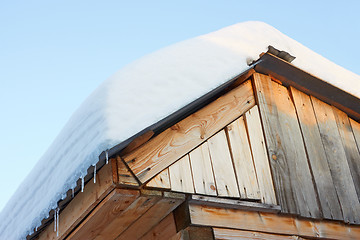 Image showing Roof of rustic wooden with snow