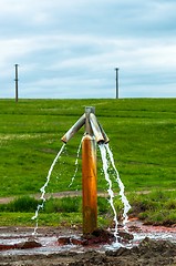 Image showing Water flowing from outdoor tap