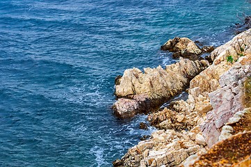 Image showing Shore of an ocean with big rocks