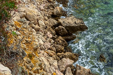 Image showing Shore of an ocean with big rocks