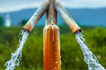 Image showing Water flowing from outdoor tap