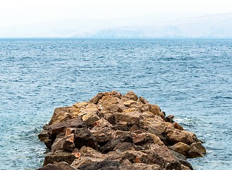 Image showing Shore of an ocean with big rocks