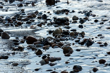 Image showing Smoothg stones at the shore
