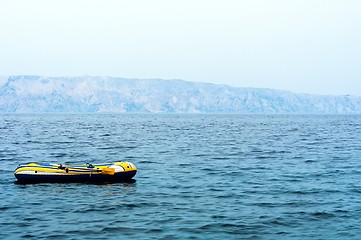 Image showing Small rubber boat on the sea