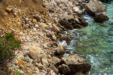 Image showing Shore of an ocean with big rocks