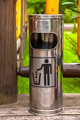 Image showing Steel garbage bin outdoors