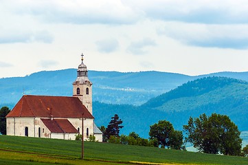 Image showing Small church with blue mountains