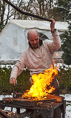 Image showing The Blacksmith Working