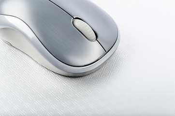 Image showing Wireless computer mouse on a metallic background