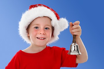 Image showing Happy child ringing bell on blue