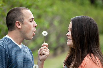 Image showing Boyfriend Blows a Dandelion