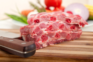 Image showing chopping fresh pork ribs and vegetables