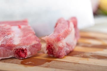 Image showing chopping fresh pork ribs 