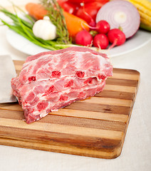 Image showing chopping fresh pork ribs and vegetables