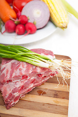 Image showing chopping fresh pork ribs and vegetables