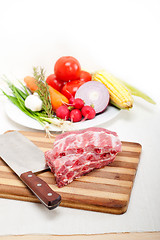 Image showing chopping fresh pork ribs and vegetables