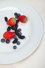 Image showing berries on white plate