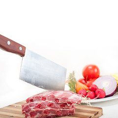 Image showing chopping fresh pork ribs and vegetables