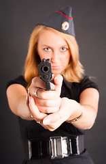 Image showing Pretty woman with a gun