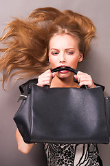 Image showing Young beautiful woman with bag