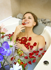 Image showing woman in rose-petals