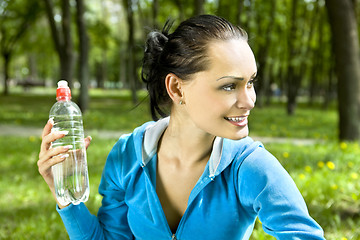 Image showing happy woman with bottle