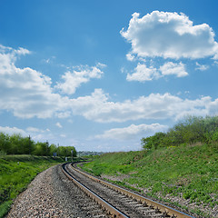 Image showing railway goes to horizon in green landscape