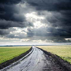 Image showing dirty road to cloudy horizon