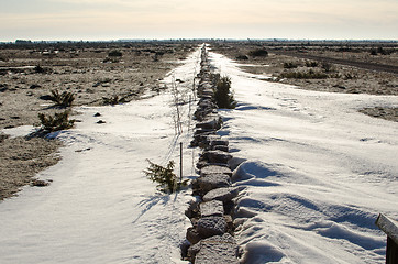 Image showing Stonewall with snowdrift