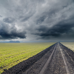 Image showing dirty road under dramatic sky