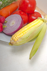 Image showing fresh vegetables and herbs on a plate 