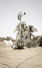 Image showing Vintage Windmill on the field 