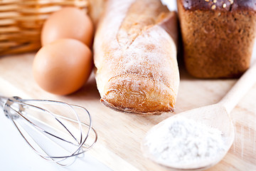 Image showing bread, flour, eggs and kitchen utensil