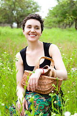 Image showing woman with basket in the garden 