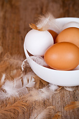 Image showing brown and white eggs in a bowl