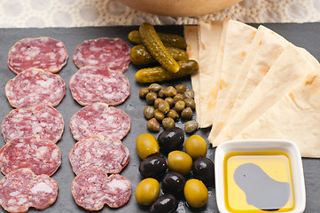 Image showing cold cut platter with pita bread and pickles