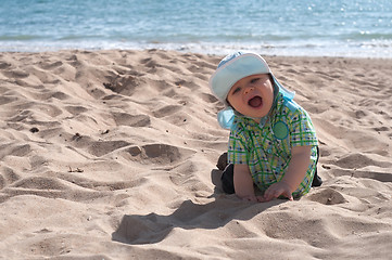 Image showing Happy baby boy on the beach