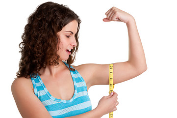 Image showing Surprised Woman measuring her Biceps